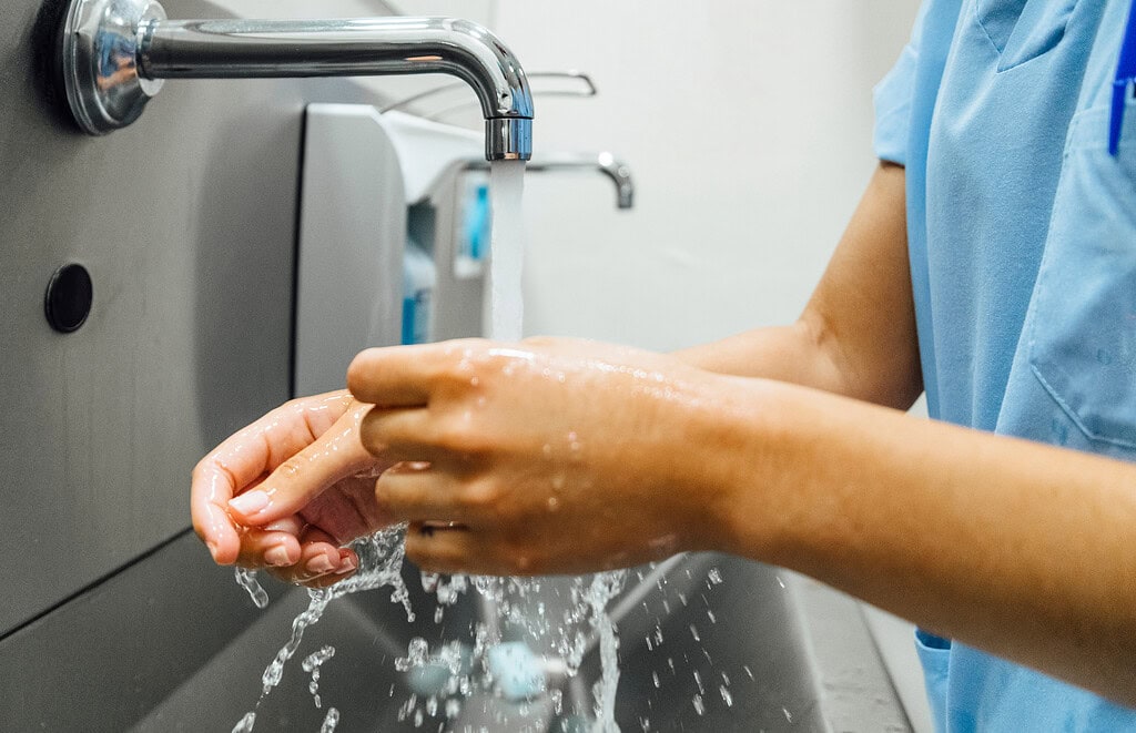 doctor washing hands before operating. hospital concept.